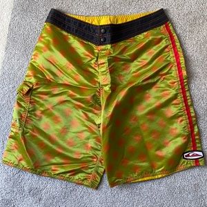 Green and orange swim trunks